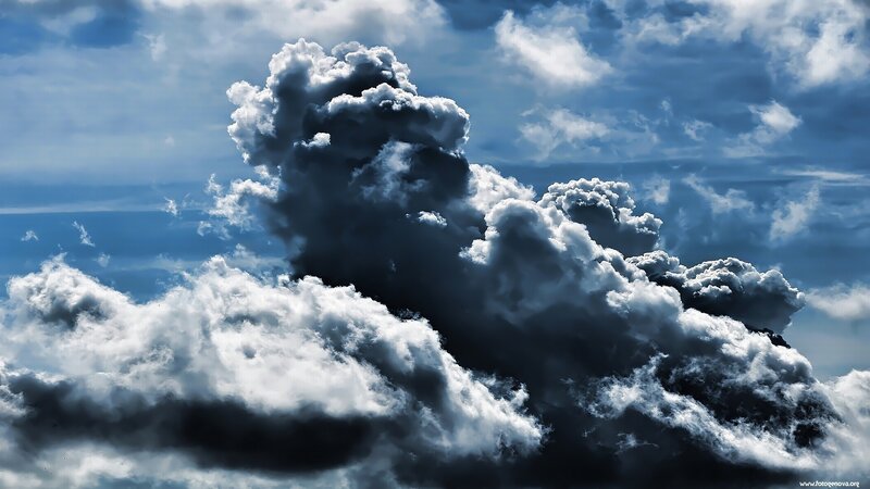 Dramatic storm clouds in blue sky