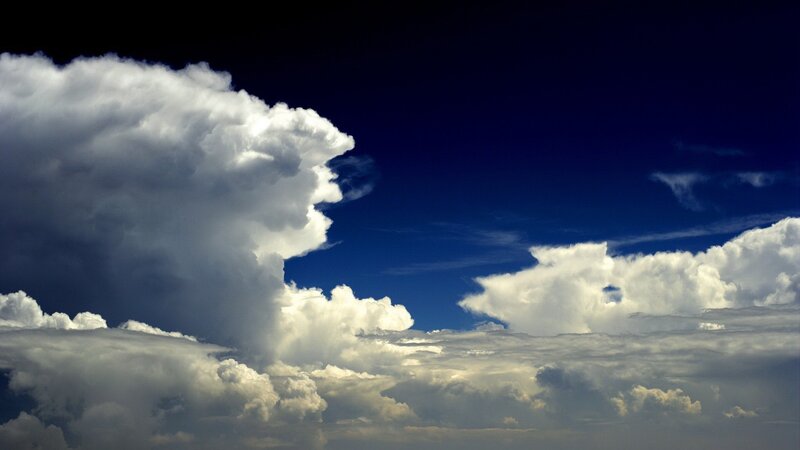 dramatic storm clouds in blue sky