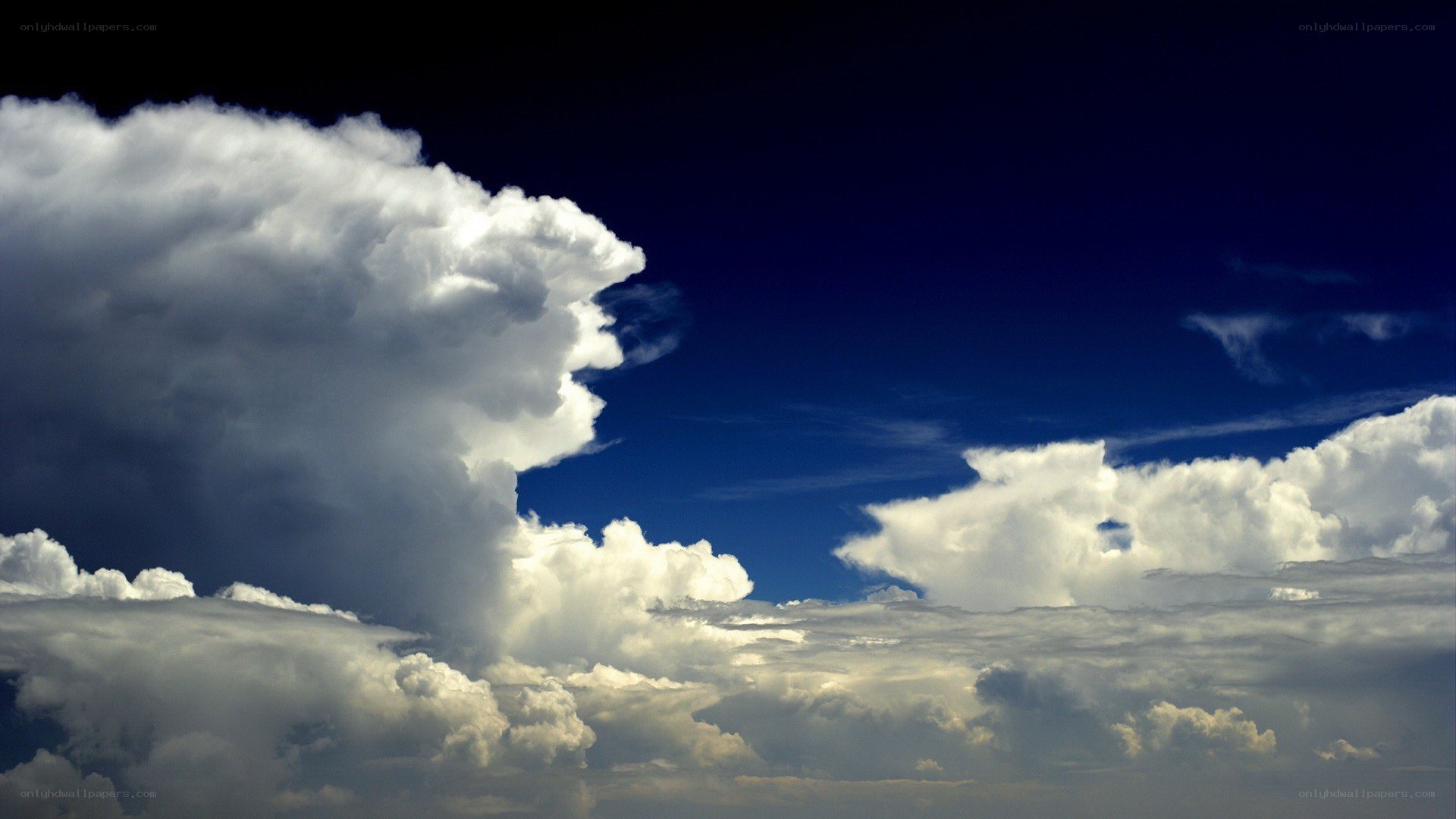 dramatic storm clouds in blue sky