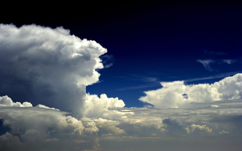 Dramatic storm clouds in blue sky