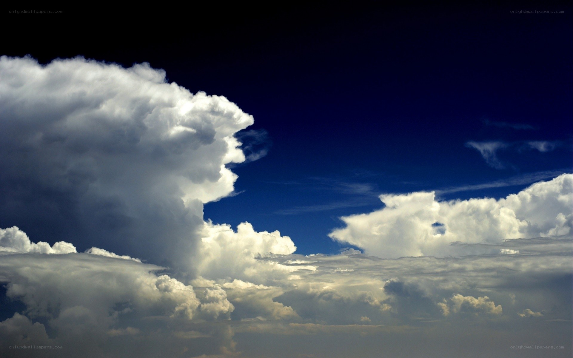 Dramatic storm clouds in blue sky