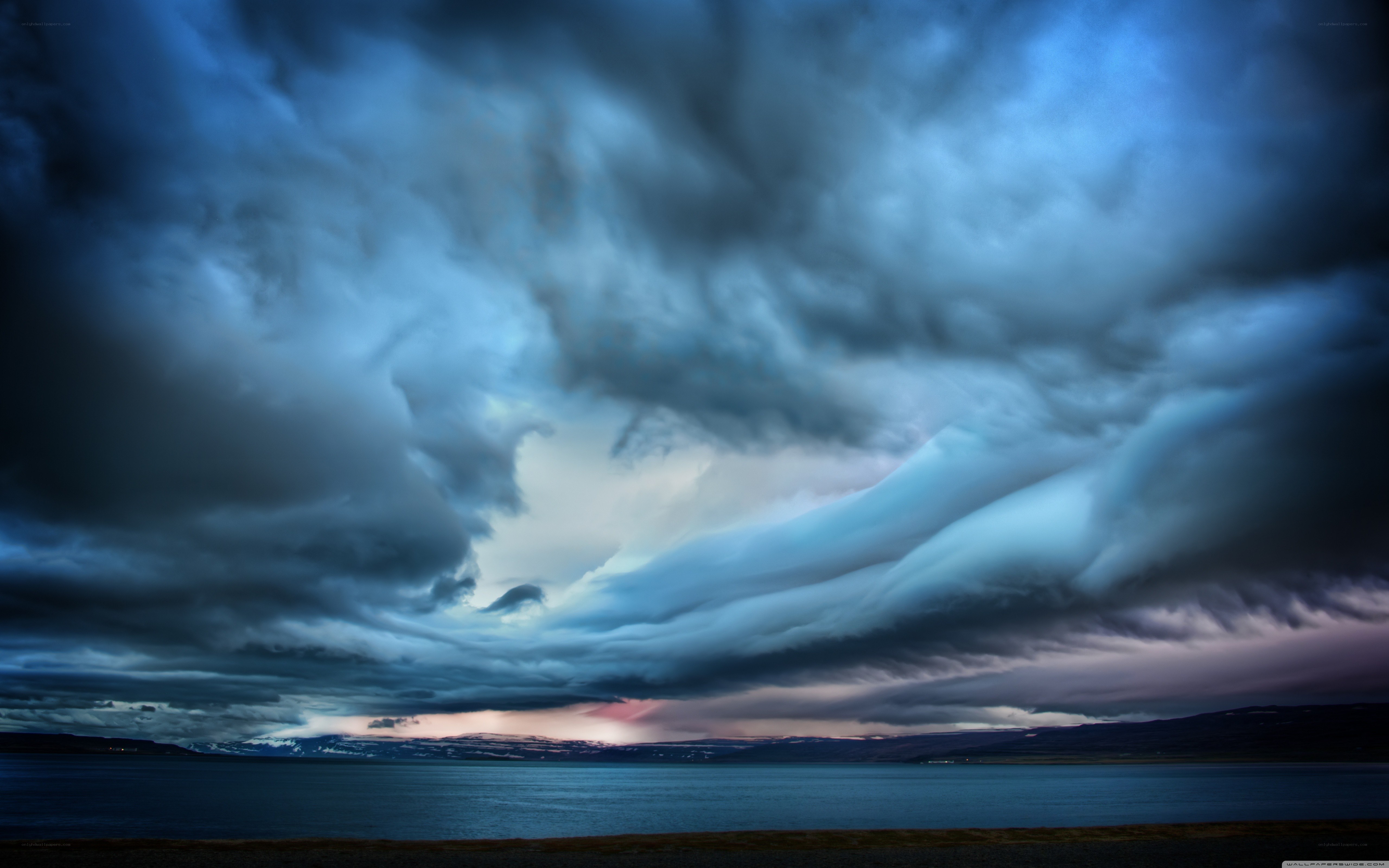 Dramatic storm clouds over a lake