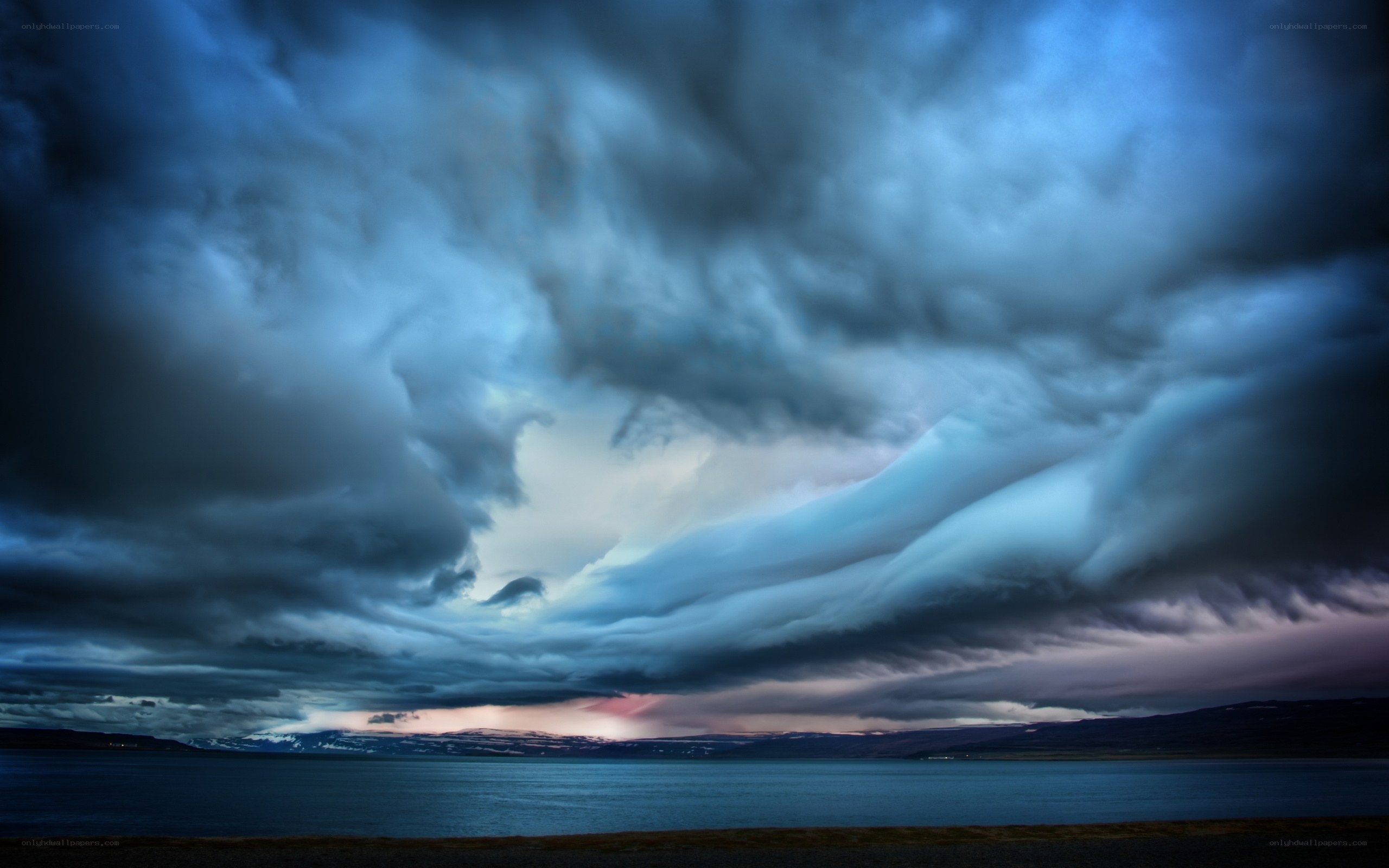 Dramatic storm clouds over a lake