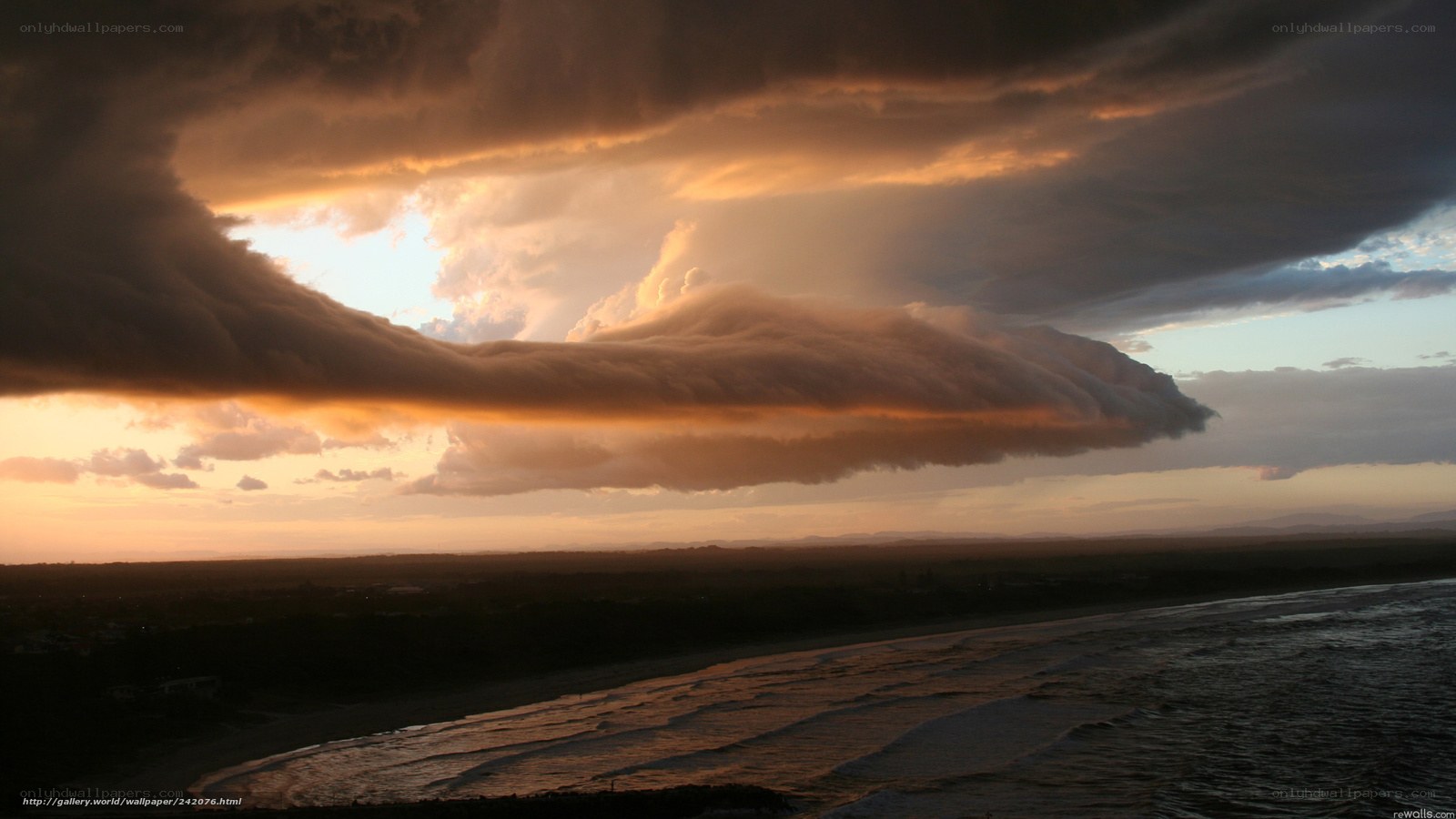 Dramatic storm clouds over beach