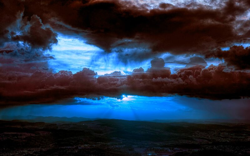 dramatic storm clouds over landscape