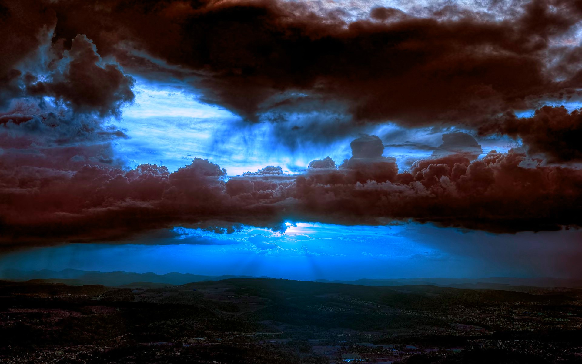 dramatic storm clouds over landscape