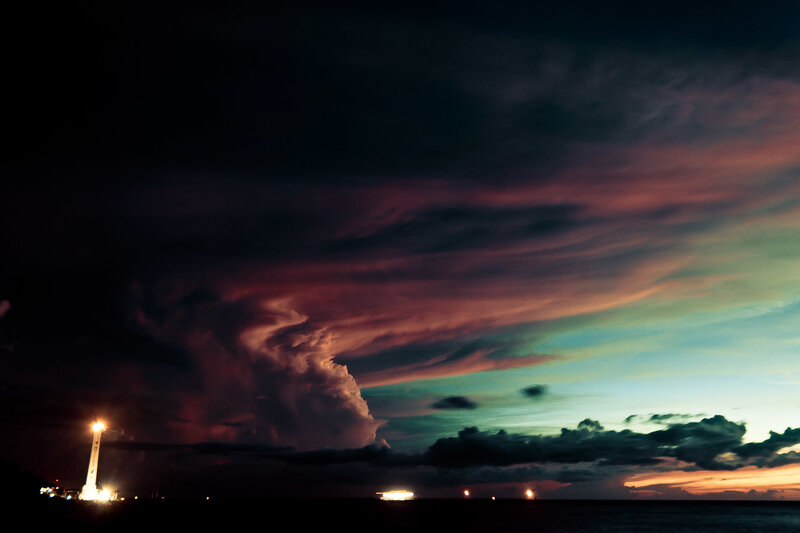Dramatic storm clouds over lighthouse