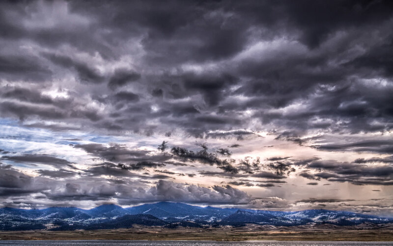 Dramatic storm clouds over mountains