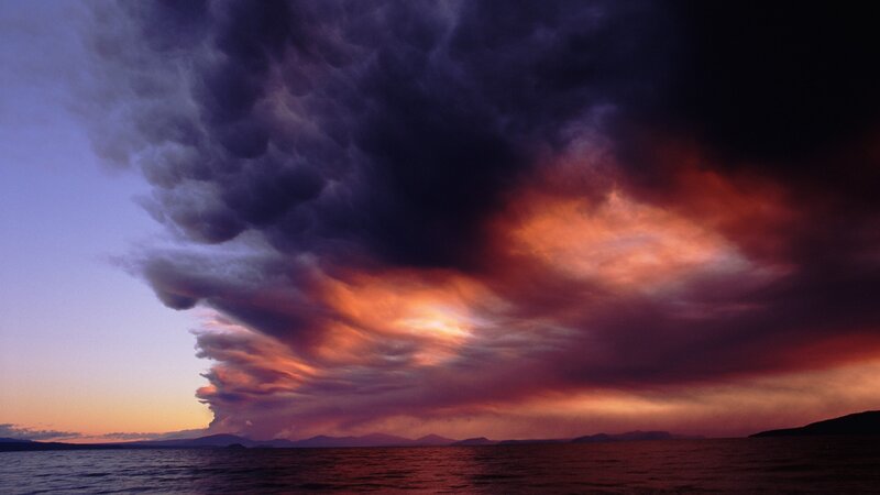 dramatic storm clouds over water
