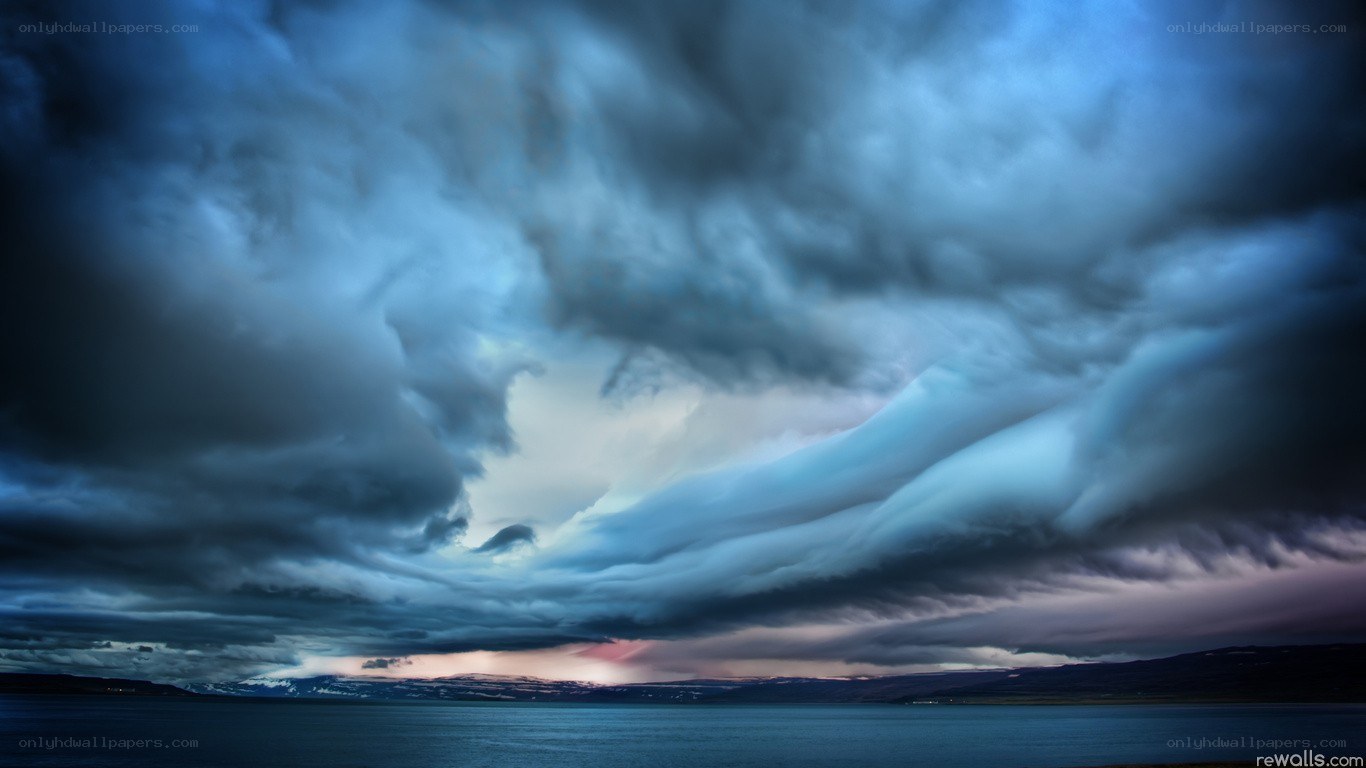 Dramatic storm clouds over water
