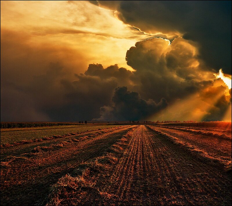 Dramatic storm over a harvested field