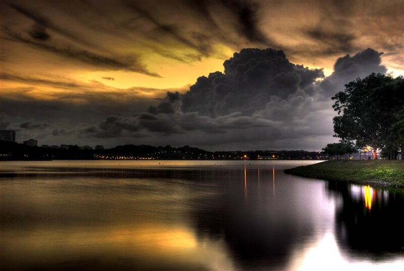 Dramatic storm over a lake at dusk