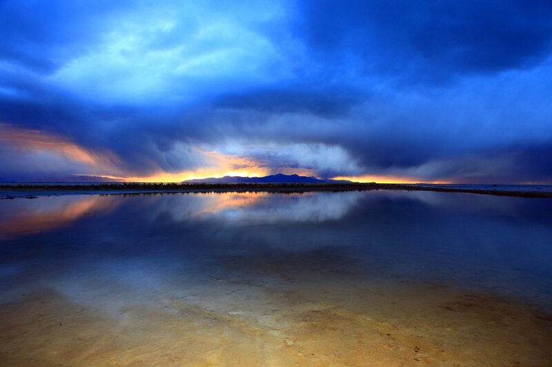 Dramatic storm over a reflective lake