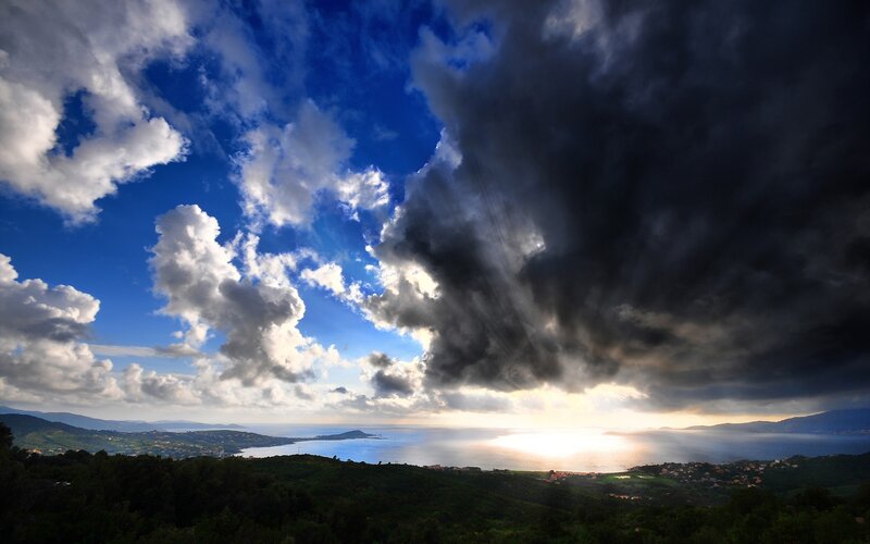 Dramatic storm over coastal landscape