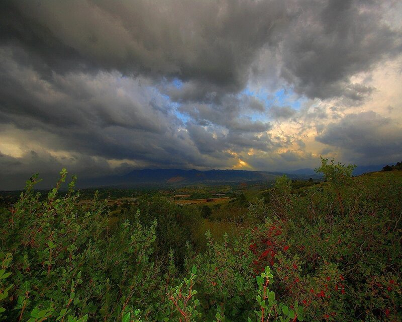 Dramatic storm over mountain valley