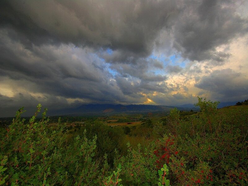 Dramatic storm over mountain valley