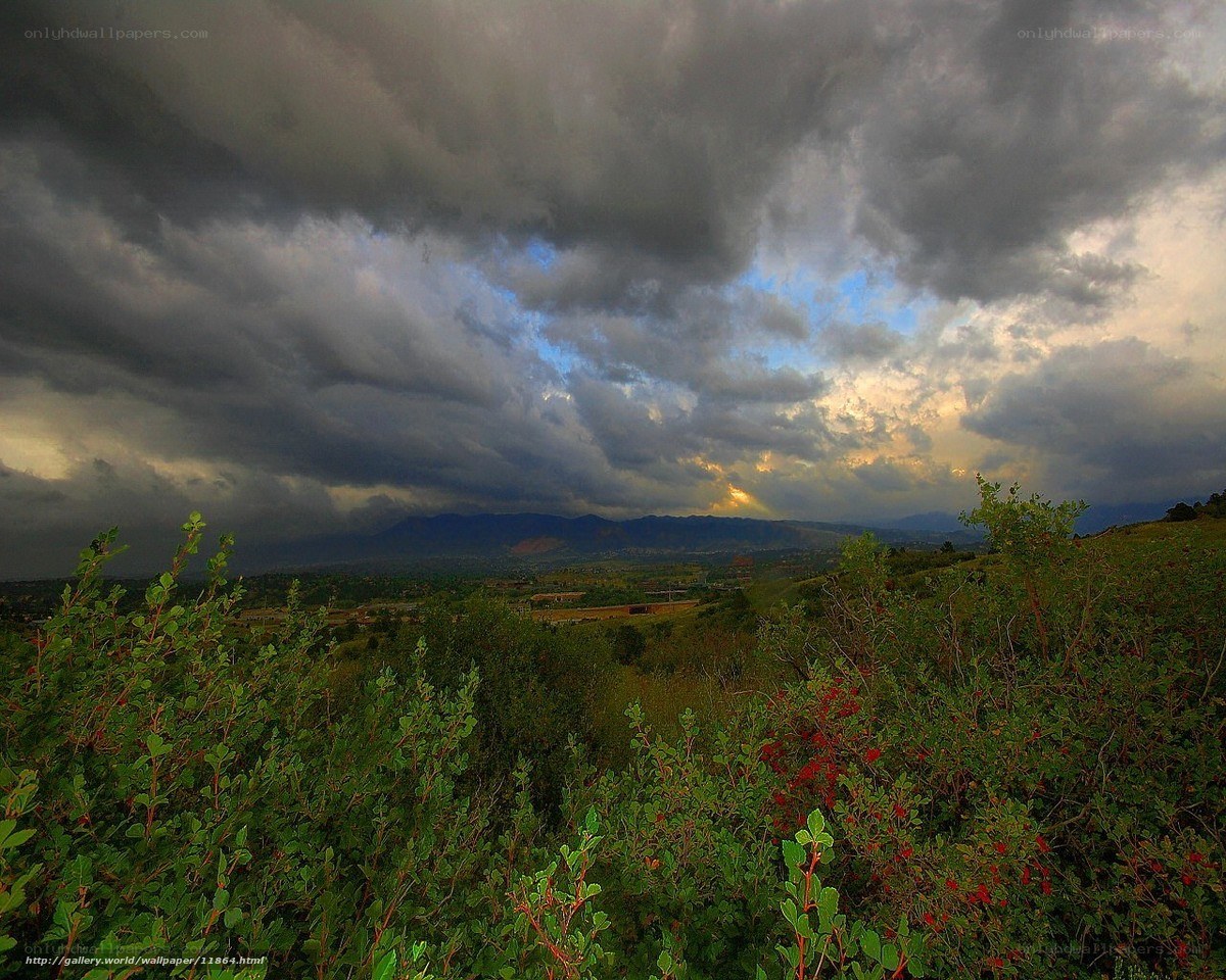Dramatic storm over mountain valley