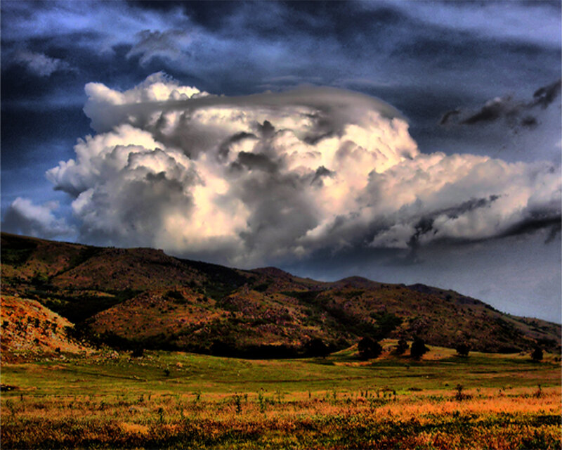 Dramatic storm over rolling hills