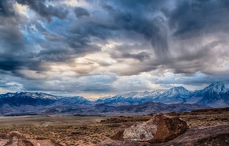 Dramatic storm over snowy mountains