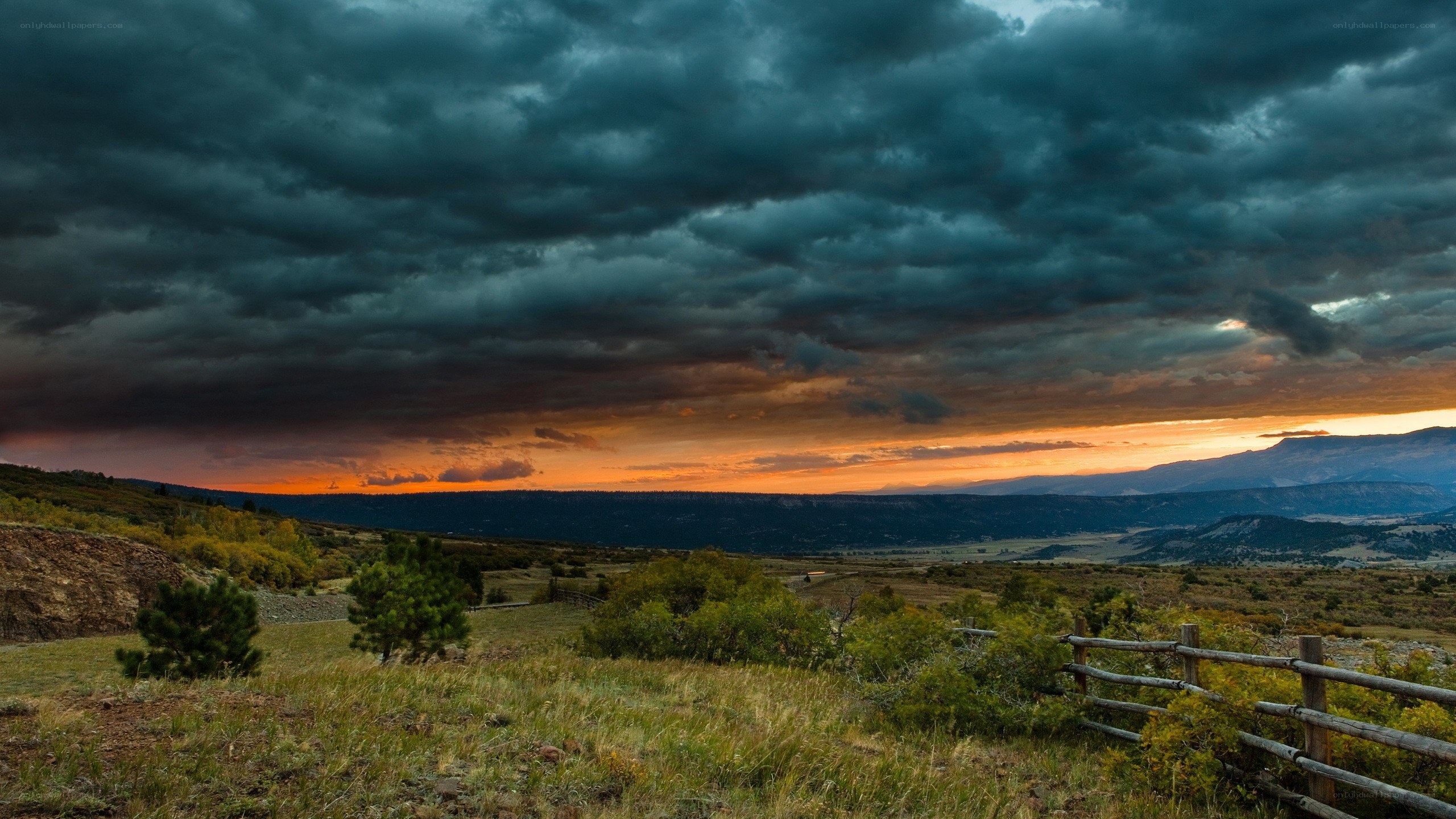 dramatic stormy sunset over hills