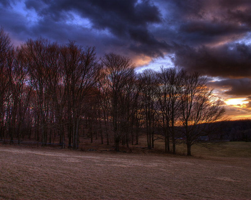 Dramatic sunset over a field