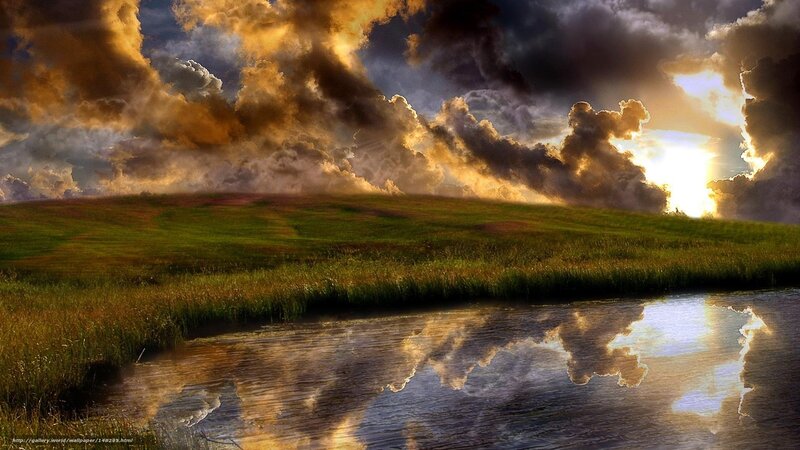 Dramatic sunset over a grassy field