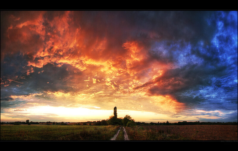 Dramatic sunset over a rural path