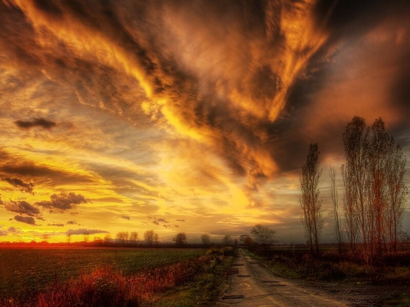 Dramatic sunset over a rural road