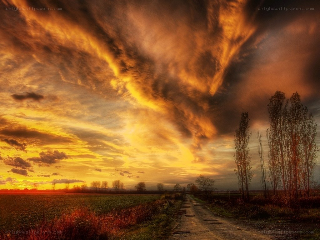 Dramatic sunset over a rural road