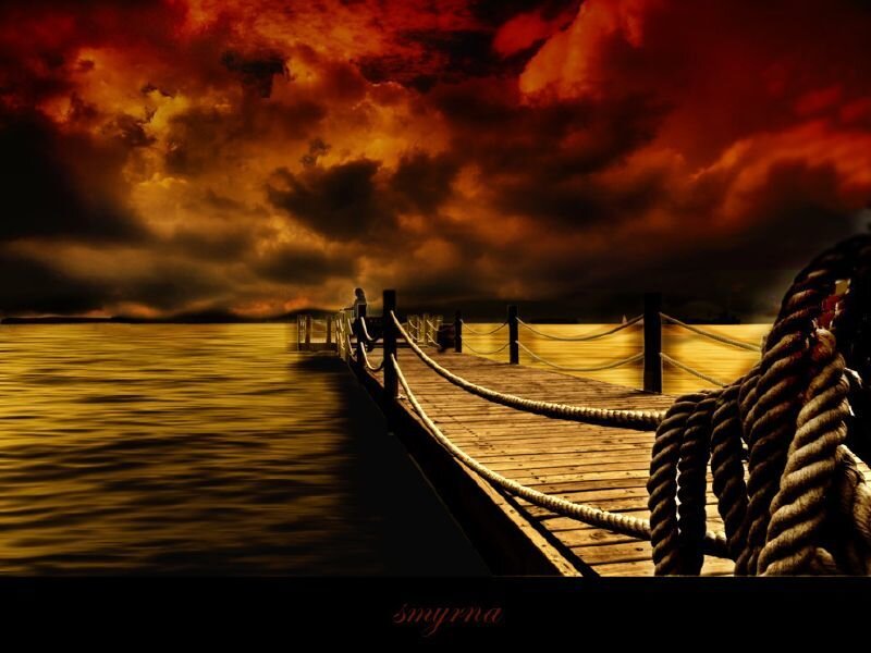 Dramatic sunset over a wooden pier