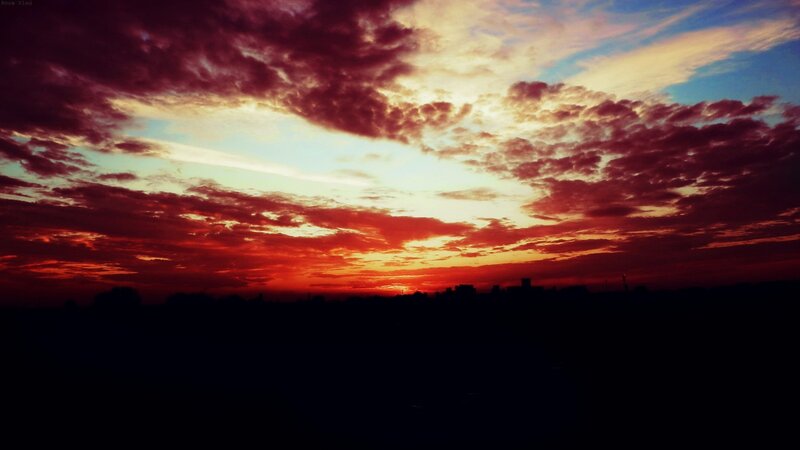 dramatic sunset over city