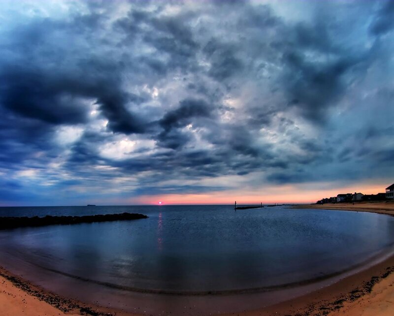 Dramatic sunset over coastal bay