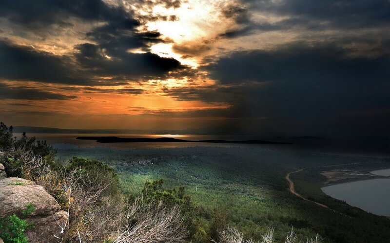 dramatic sunset over coastal landscape