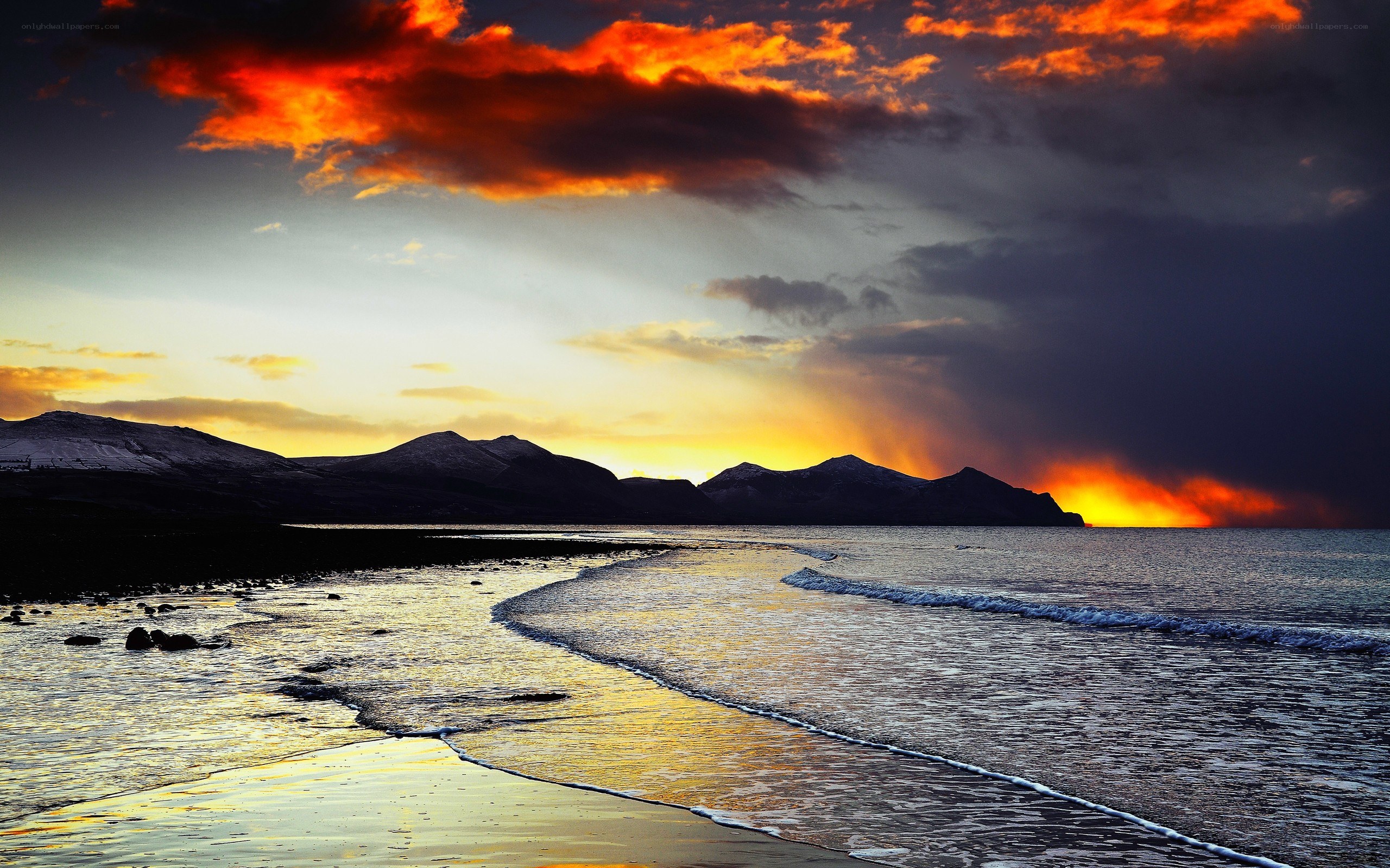 Dramatic sunset over coastal mountains
