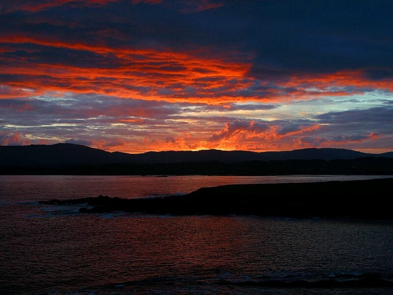 dramatic sunset over coastal waters