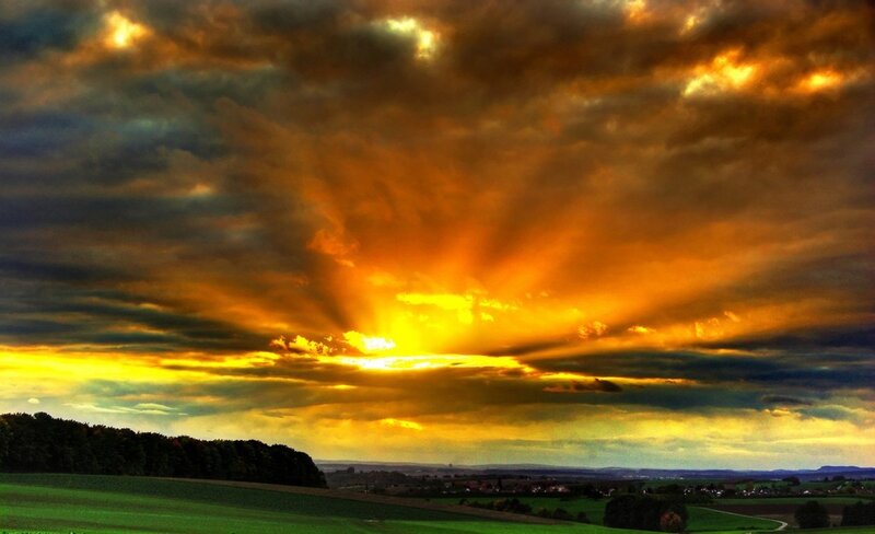 dramatic sunset over fields