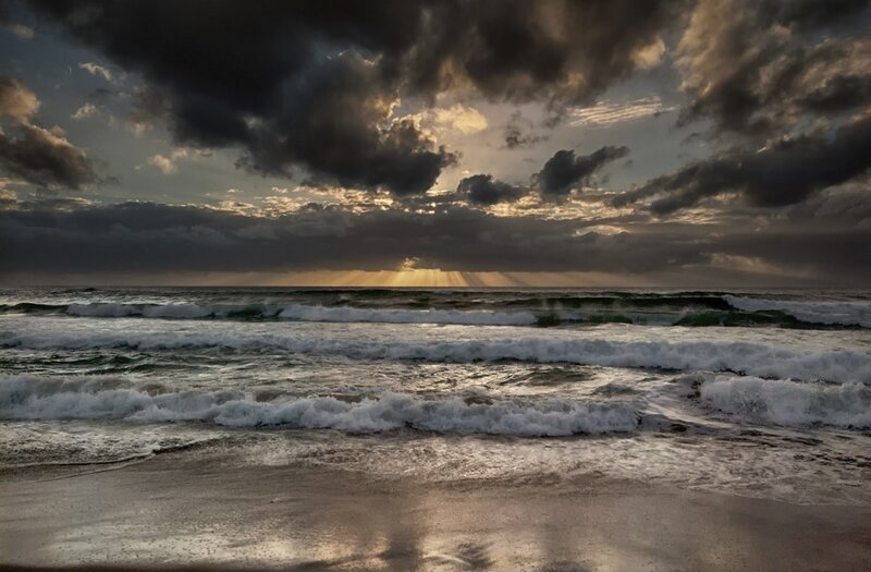 Dramatic sunset over ocean waves