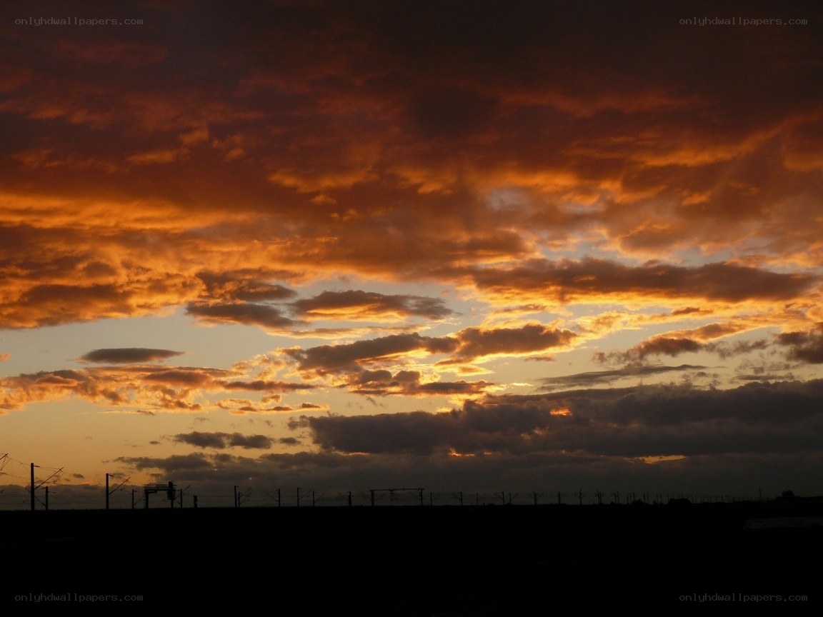 dramatic sunset over railway