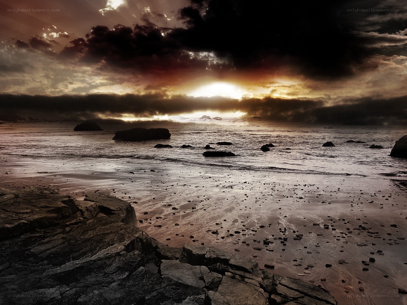 Dramatic sunset over rocky beach