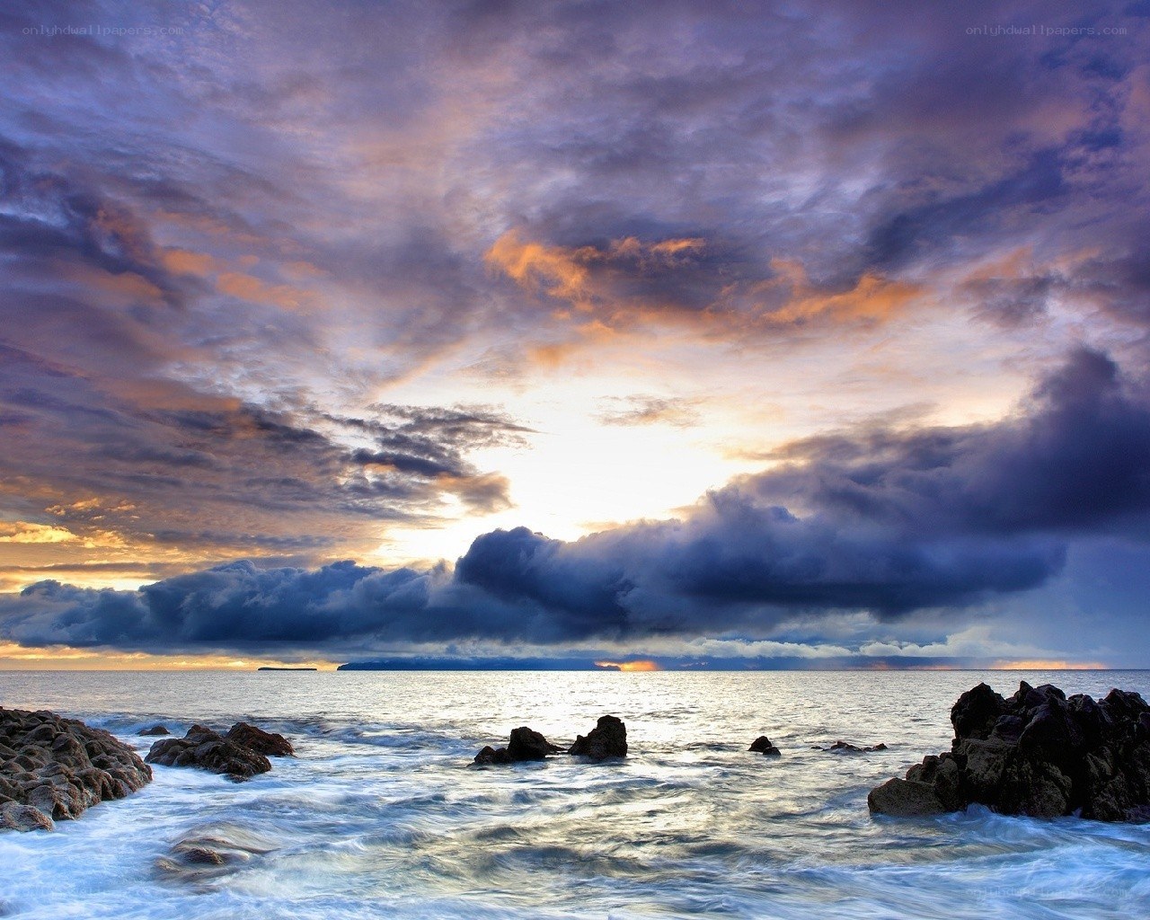 Dramatic sunset over rocky coast