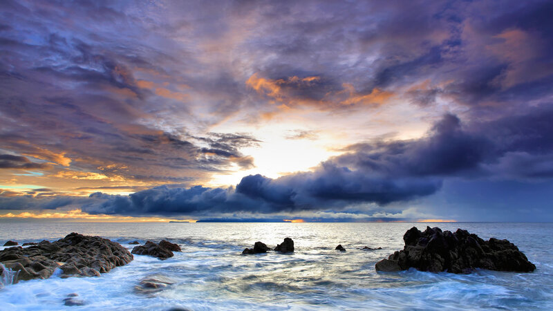 Dramatic sunset over rocky coast
