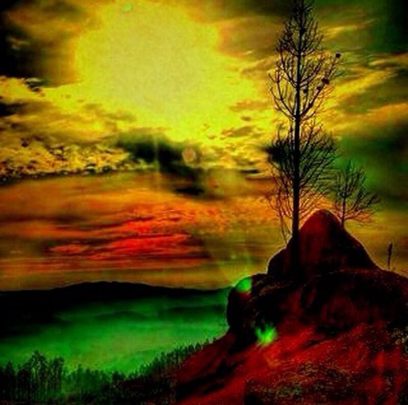 dramatic sunset over rocky hill