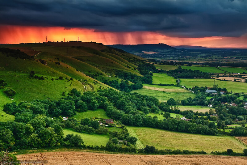 Dramatic sunset over rolling hills
