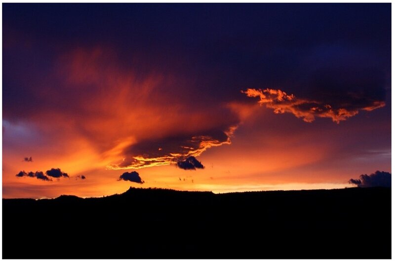 dramatic sunset over silhouetted hills