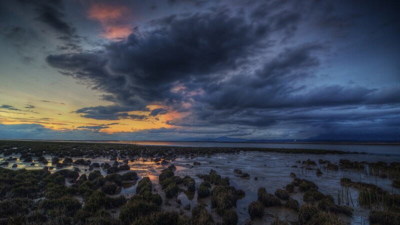 Dramatic sunset over tidal flats