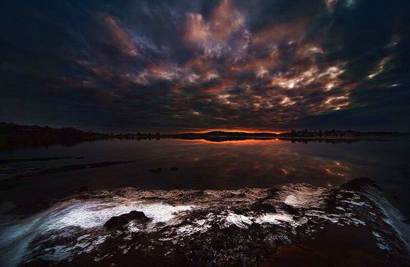 Dramatic Sunset over Water — Orange
