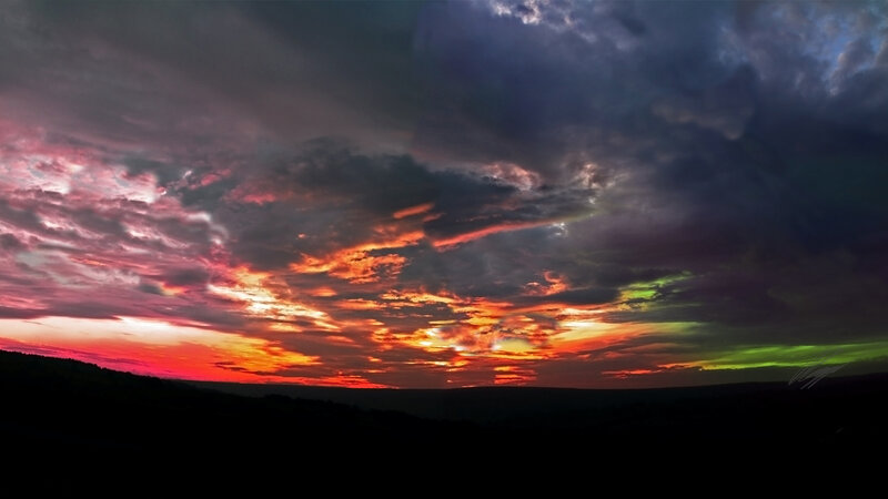 dramatic sunset with aurora