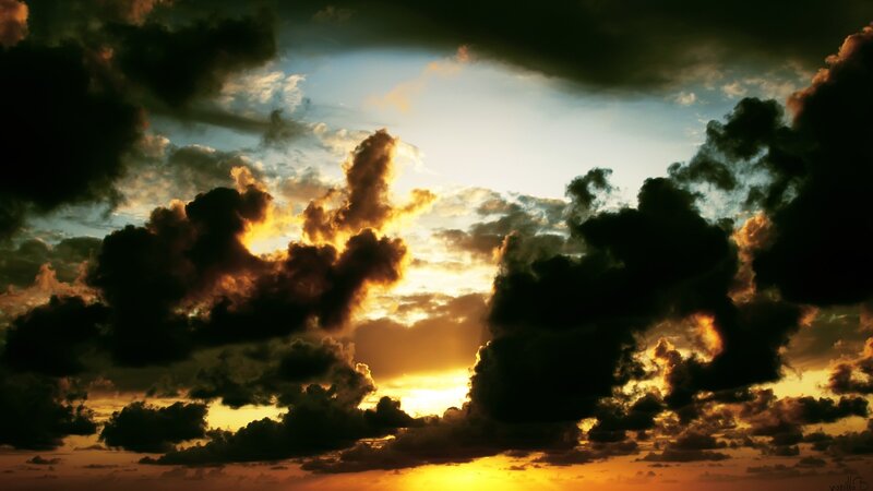 dramatic sunset with dark clouds