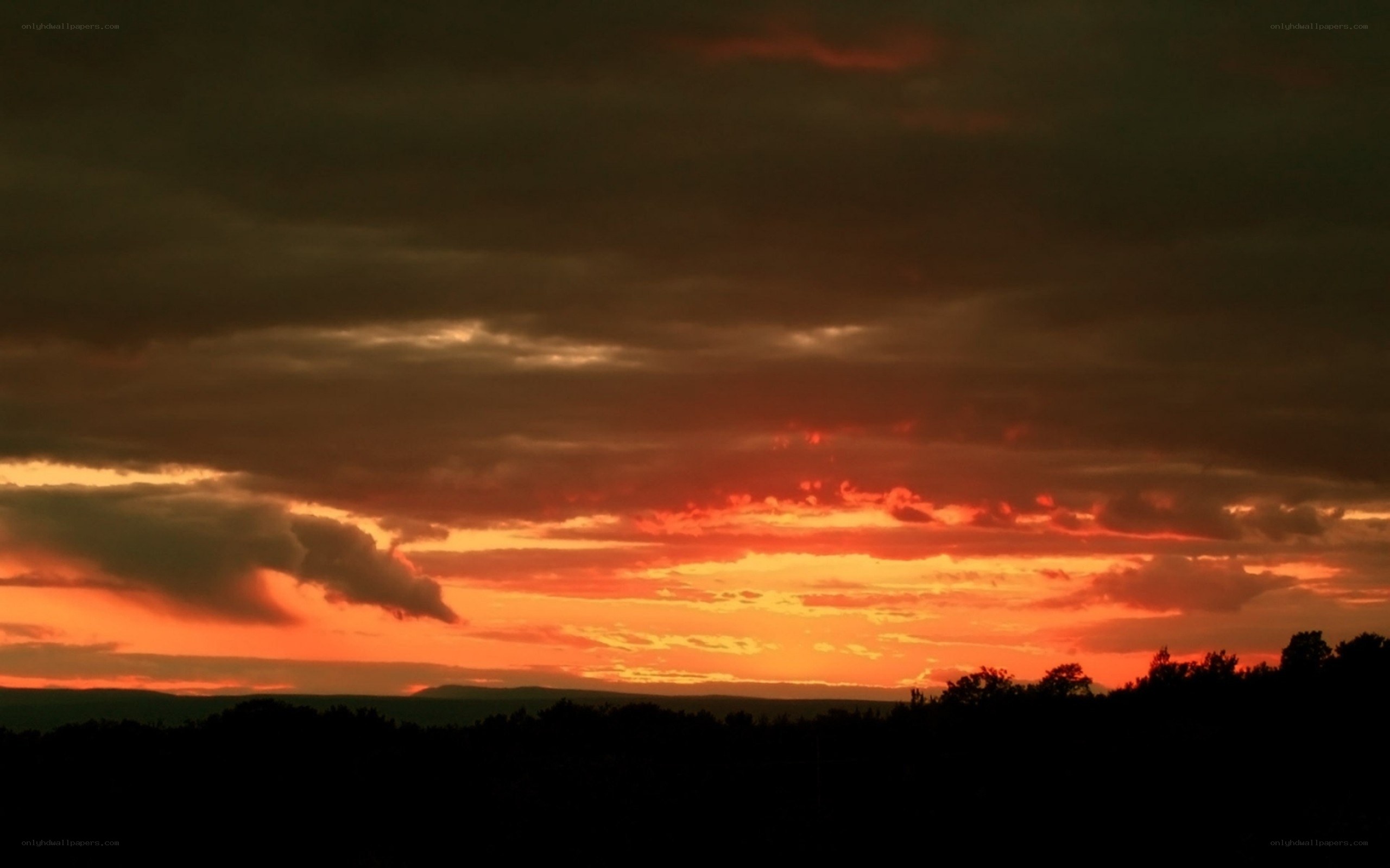 dramatic sunset with dark clouds