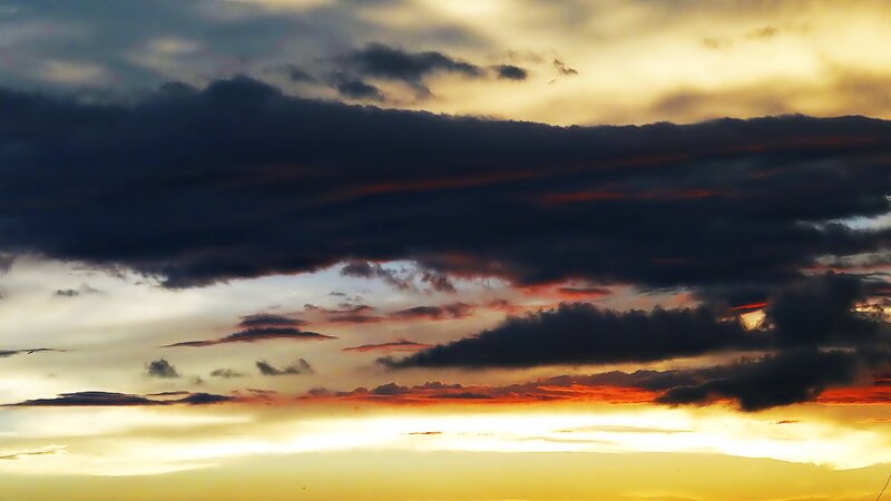 dramatic sunset with dark clouds